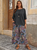 Conjunto camisa em gola redonda e calças de perna larga Ligía