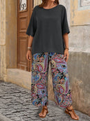 Conjunto camisa em gola redonda e calças de perna larga Ligía